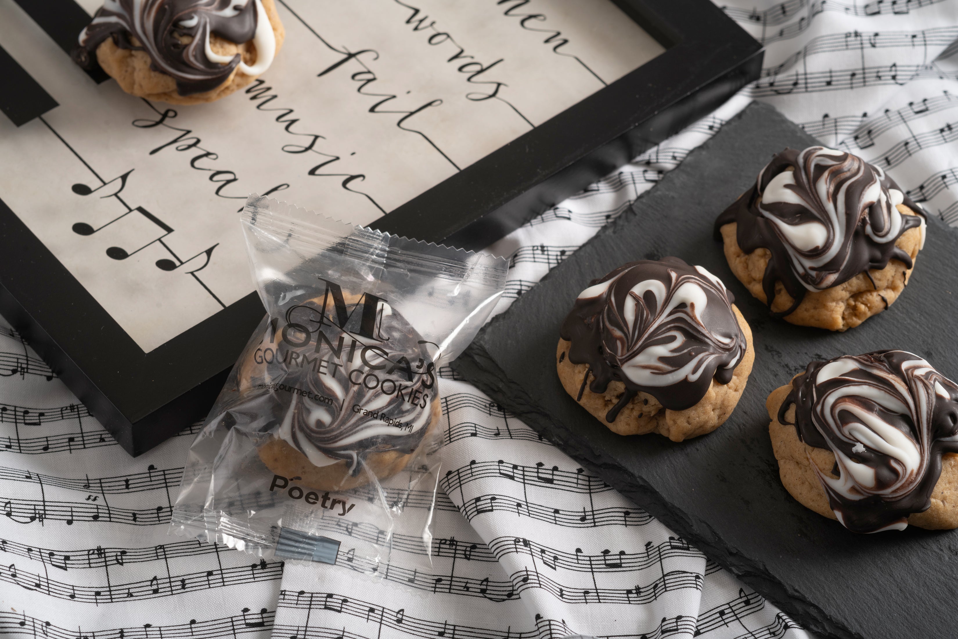 Poetry cookies on a music note platter.