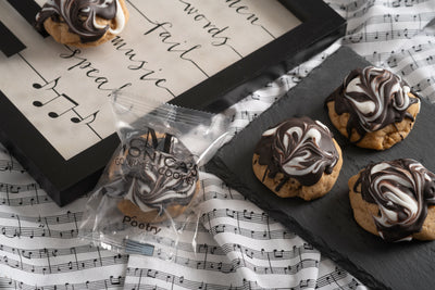 Poetry cookies on a music note platter.
