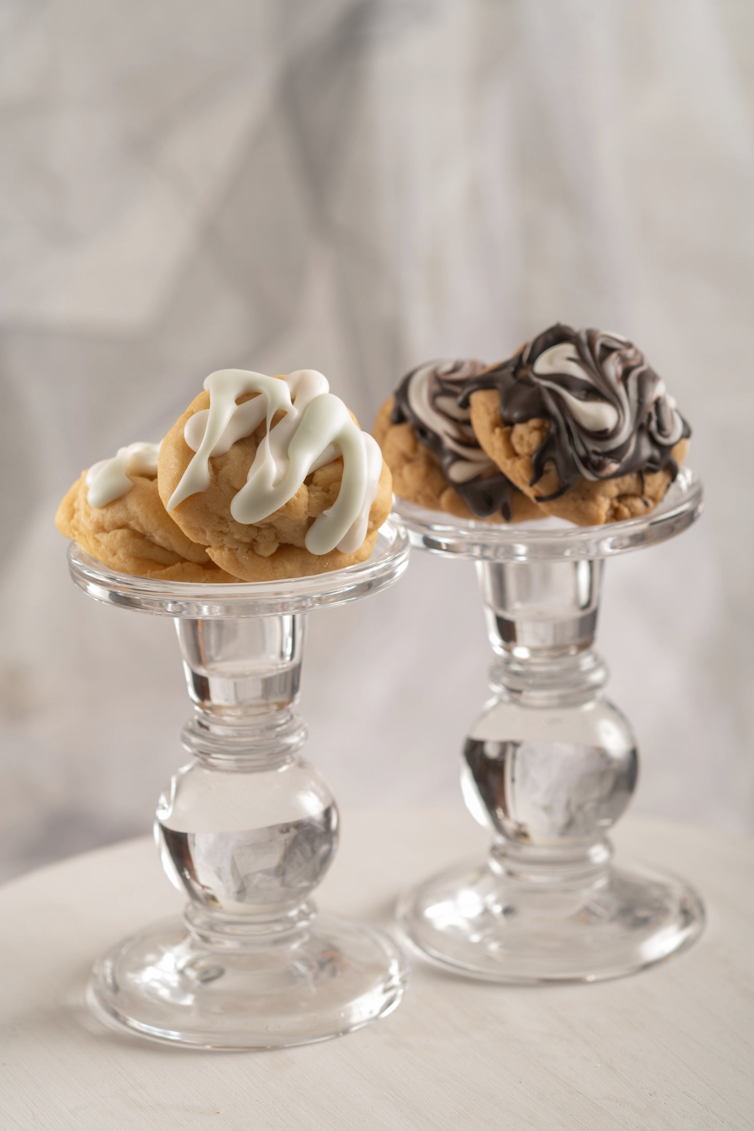 In Motion and Poetry cookies on clear candle sticks.