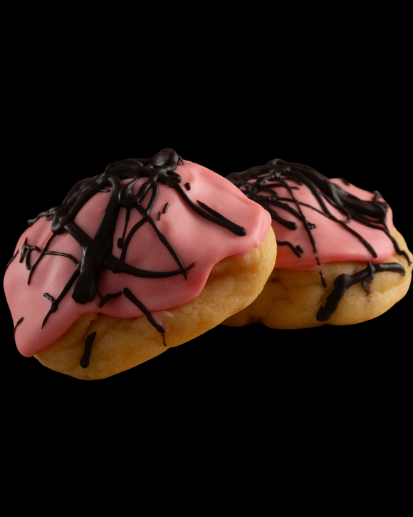 Our seasonal, handcrafted, gourmet Naughty Almond cookie, featuring an almond dough, an almond/raspberry icing, and dark chocolate drizzle.