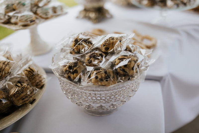 A crystal bowl filled with our individually wrapped oatmeal chocolate chip cookies.
