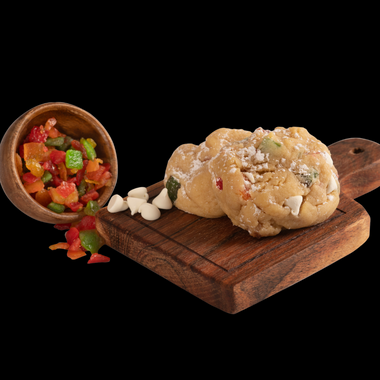 Our gourmet Not Your GG's Fruitcake cookie, made with candied peals, white chocolate, and powdered sugar.