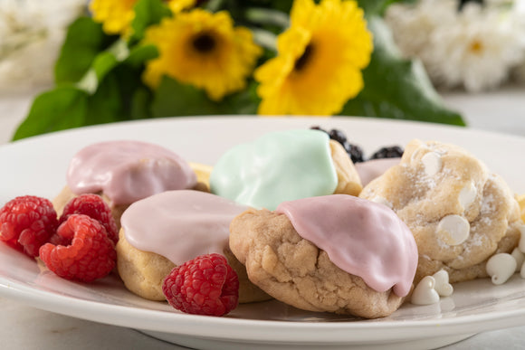 Spring flowers, featuring a platter of our spring cookies like iced raspberry, iced key lime, white chocolate chiffon, and some fresh raspberries.