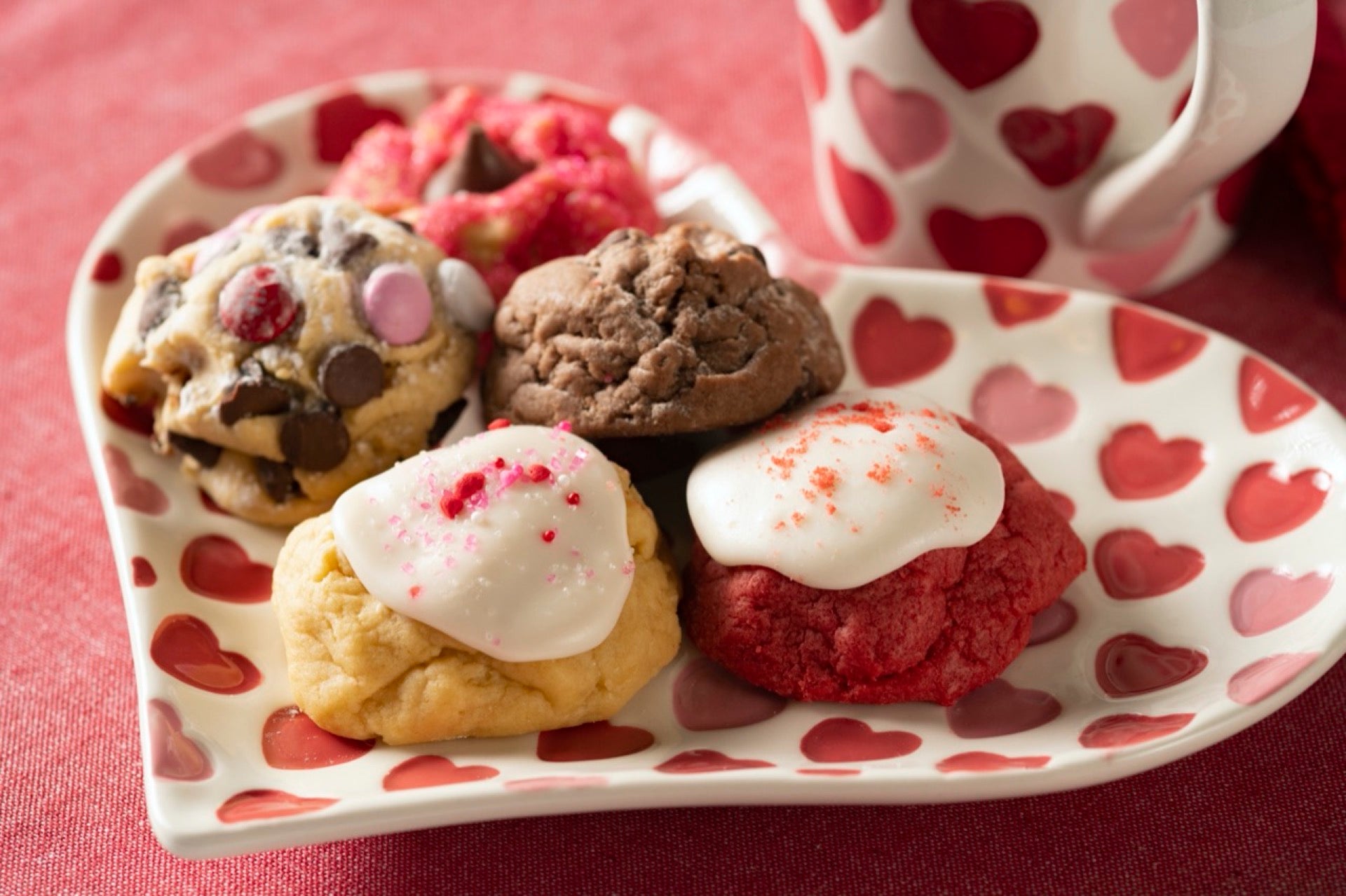 Valentine platter with hearts, filled with iced sugar gems, red velvet, brownie, and candied chocolate chip.