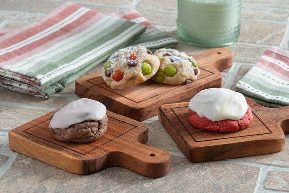 Brownie Raspberry, Red Velvet, and Candied Chocolate Chips on little boards.