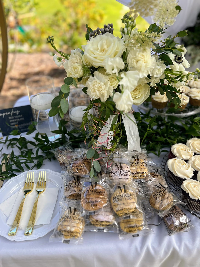 Wedding flowers on a wedding table, featuring our individually wrapped cookies.