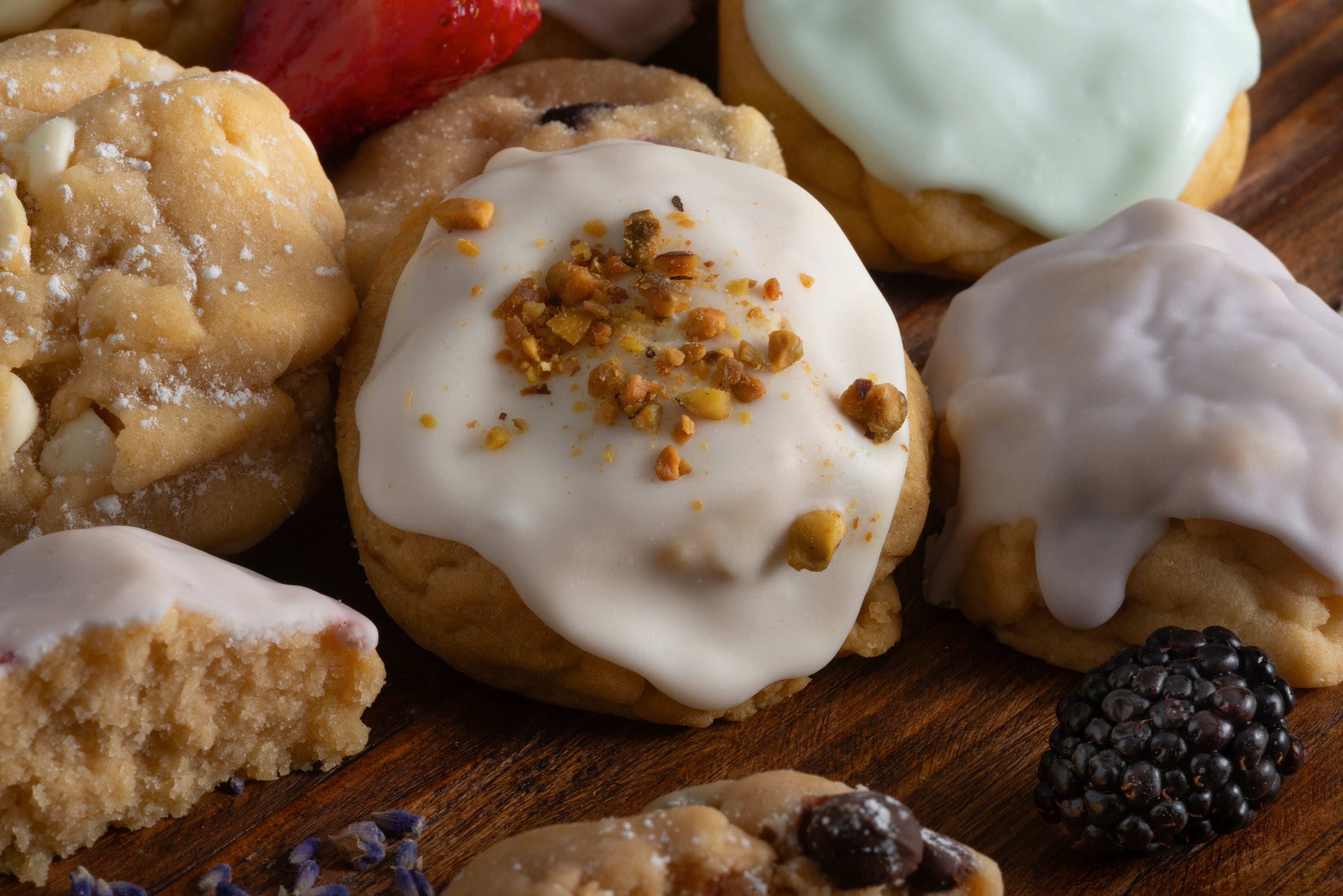 Royal Coronation, Violet, Iced Keylime, and White Chocolate Almond Macadamia on a cutting board.