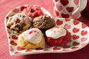 A valentine plate featuring red velvet, brownie grenade, and iced sugar gems.