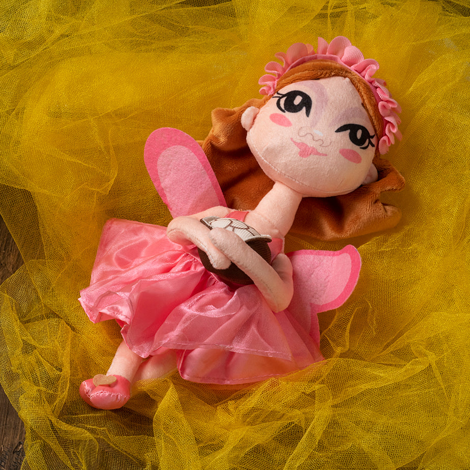Sugarbelle, the Cookie Fairy, is soft plushy doll, and ready to go on all your adventures!