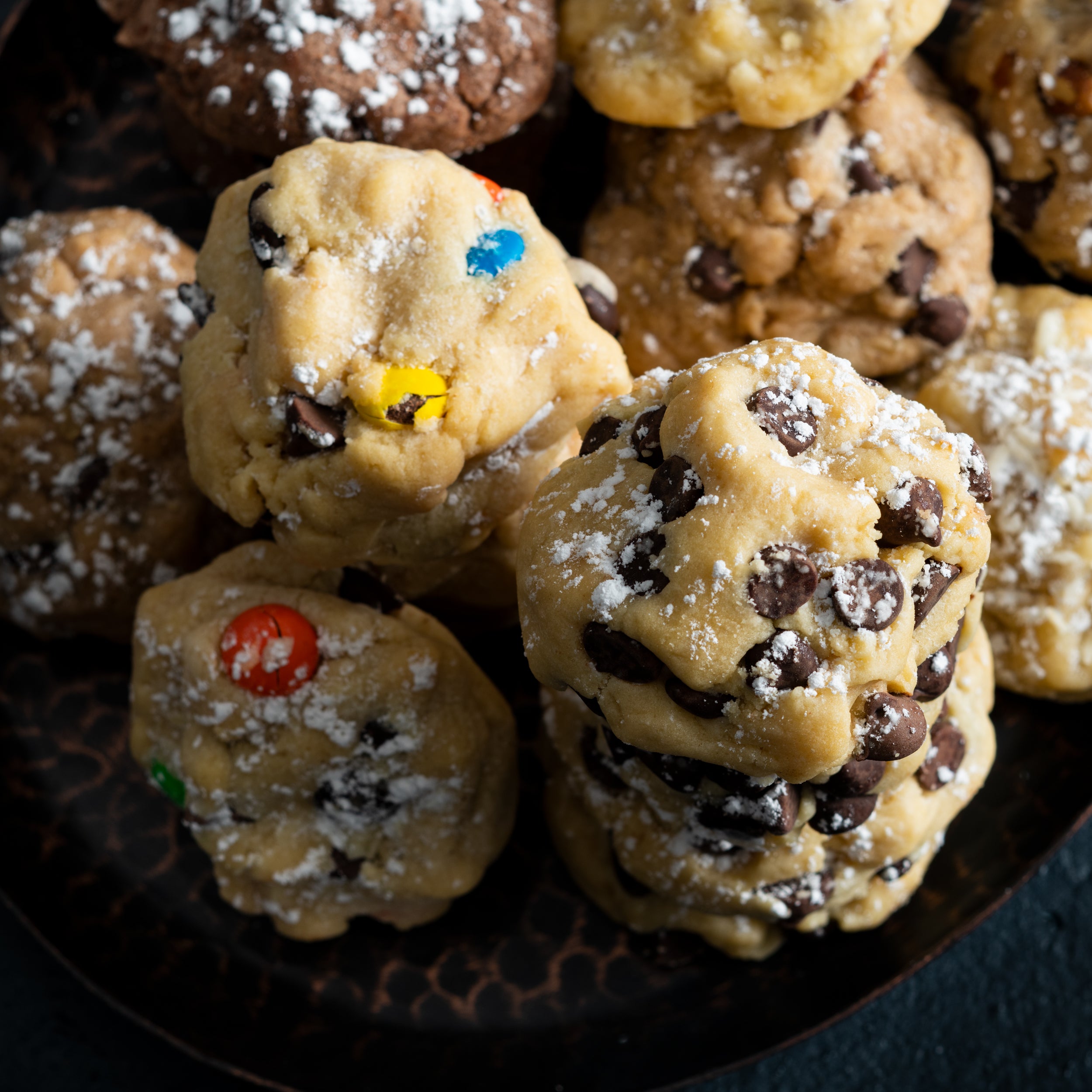 A close up of our Candied Chocolate Chip, Chocolate Chip, Mocha Chip, and our Trio cookies.